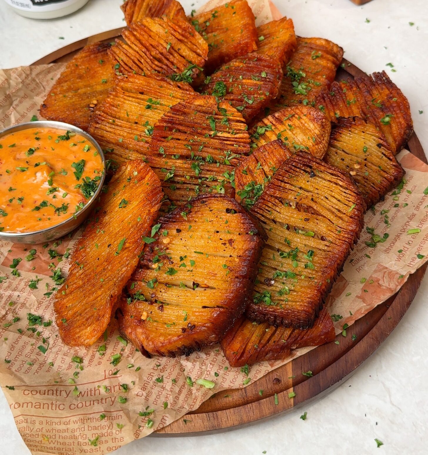 Golden crispy accordion potatoes with a creamy dipping sauce
